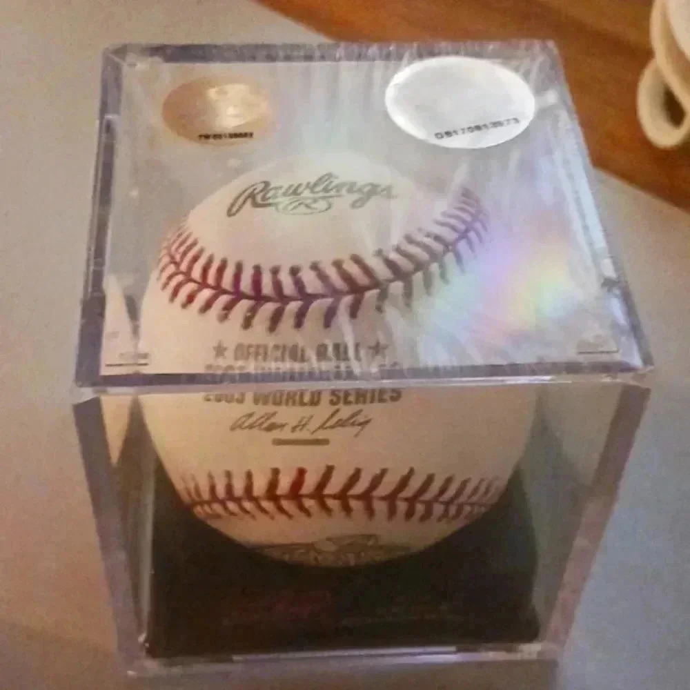One "2003" real world series baseball in original box. NWT..collectable choice.